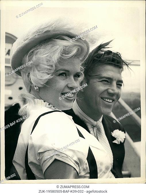 May 05, 1958 - Jayne is off to Spain.: Photo shows Hollywood film star Jayne Mansfield pictured at London Airport yesterday with her husband, Mickey Harcitay