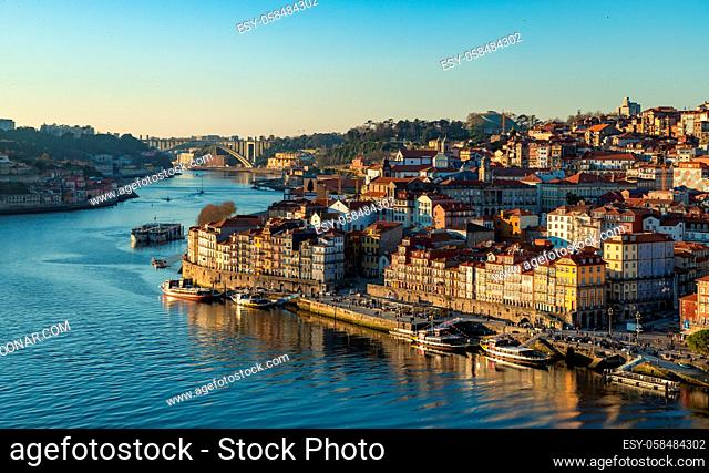A picture of the Porto cityscape and the Douro river at sunset