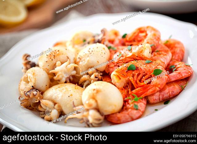 Grilled prawns and cuttlefish on a plate. High quality photo