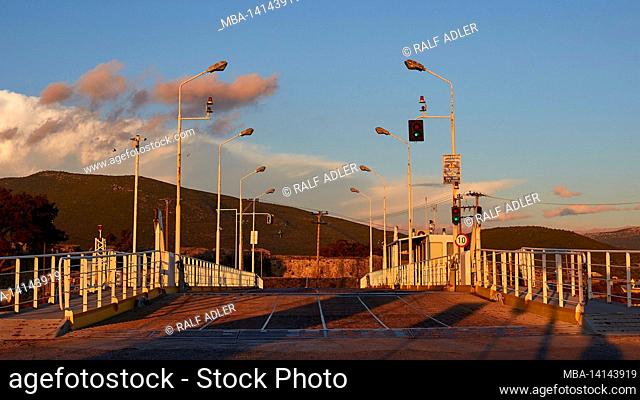 greece, greek islands, ionian islands, lefakada or lefkas, lefkada city, capital, dusk, swing bridge, lighthouse, swing bridge head-on towards the roadway