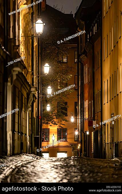 Stockholm, Sweden A cobblestone street in Gamla Stan or Old Town called Sjalagardsgatan