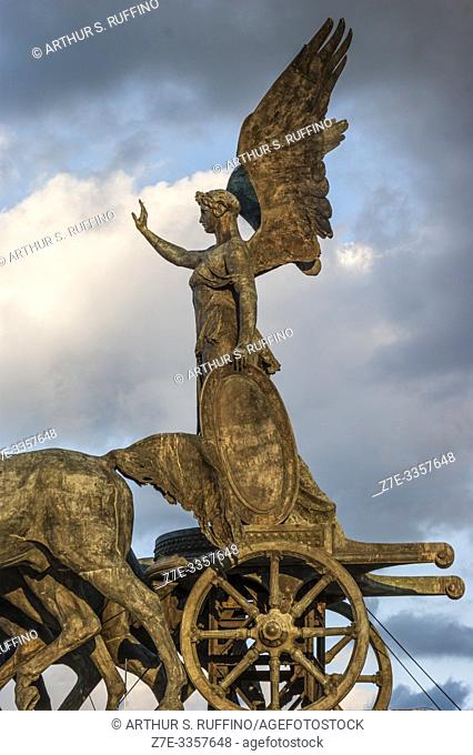Detail of Statue of Goddess Victoria on a Quadriga (Winged Victory Statue) at sunset. Victor Emmanuel II Monument (Monumento Nazionale a Vittorio Emanuele II)