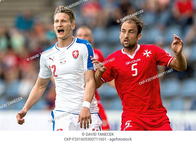 Andrei Agius of Malta, right, and Milan Skoda, left, of Czech Republic in action during a friendly soccer match between Czech Republic and Malta in Kufstein