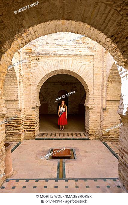 Woman with red dress, Arab baths, Alcázar de Jerez, Jerez de la Frontera, Cádiz province, Andalusia, Spain