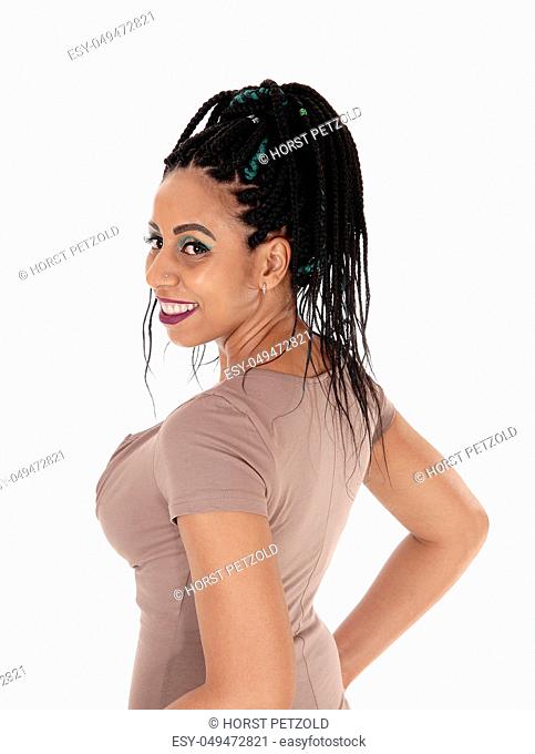 A close up portrait of a woman with her nice braided black long hair in profile, isolated for white background
