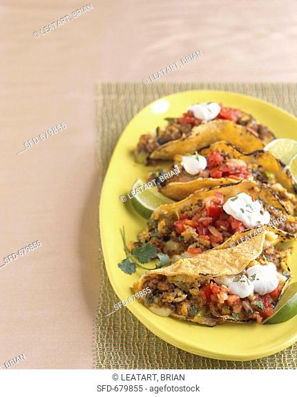 Platter of Beef Tacos with Salsa and Sour Cream