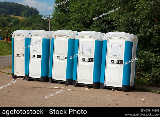 Group of mobile toilet cabins at a festival