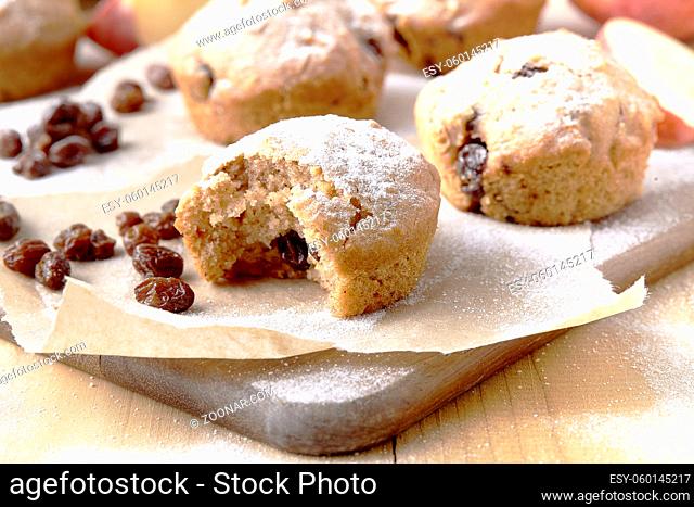 Traditional German Christmas pastry mini stollen on parchment paper on plank wood table