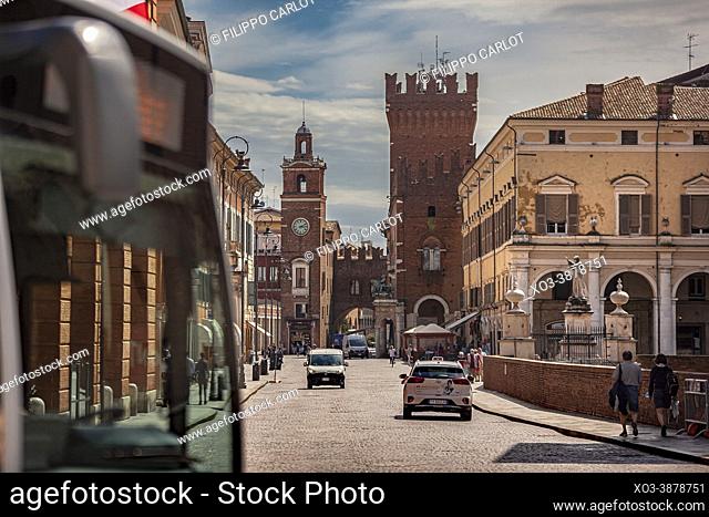 FERRARA, ITALY: Evocative view of the road leading to the historic center of Ferrara with a view of the castle and life on the road