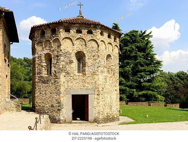 view from west of the octagonal baptistery of ancient Romanesque church in Brianza region, near Milan, shot in bright summer light