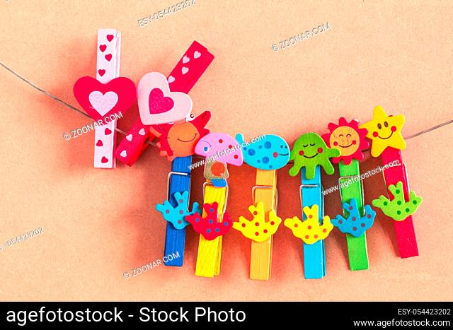 Heart-shaped pin with colorful on wooden floor