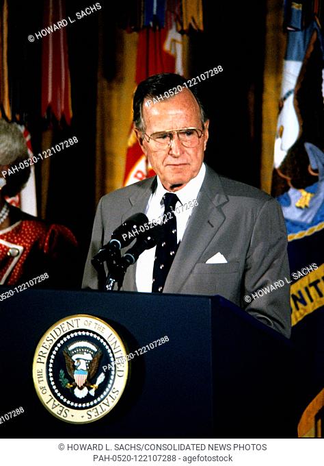 United States President George H.W. Bush makes remarks as he and first lady Barbara Bush present the Presidential Medal of Freedom during a ceremony in the East...