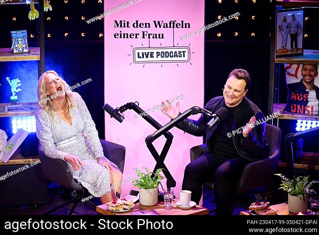 17 April 2023, Hamburg: Host Barbara Schöneberger (l) and her guest Guido Maria chat during Schöneberger's live podcast ""With the Waffles of a Woman"" at the...