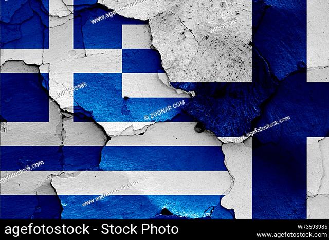 flags of Greece and Finland painted on cracked wall