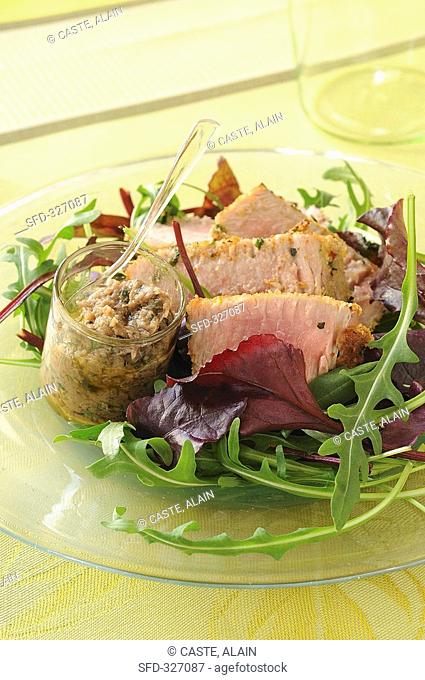 Breaded tuna on salad leaves with anchovy paste