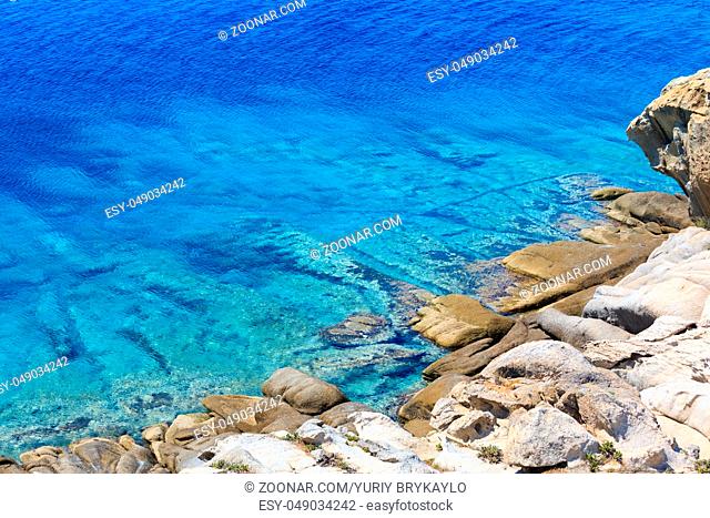 Summer stony Aegean sea coast (Halkidiki, Sithonia, Greece)