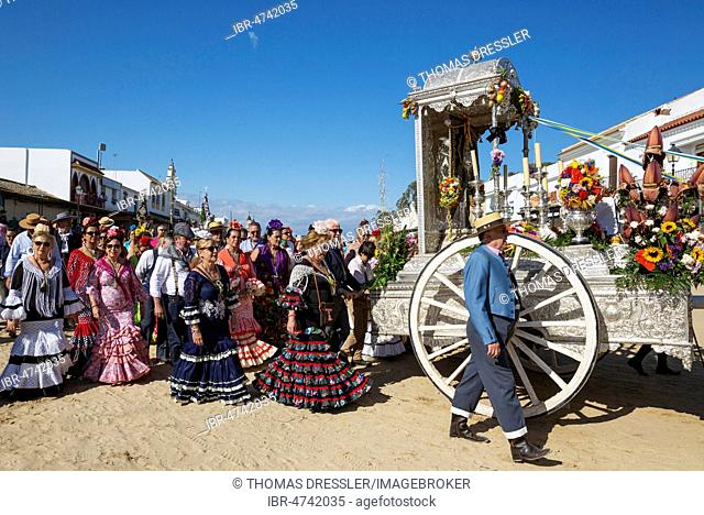 People in traditional clothes and decorated oxcarts, Pentecost pilgrimage of El Rocio, Huelva province, Andalusia, Spain