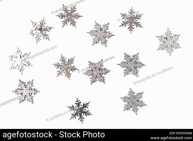 Silver color christmas snowflakes isolated on white