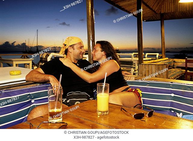 couple having a drink at Basil's bar, Mustik, Grenadines islands, Saint Vincent and the Grenadines, Winward Islands, Lesser Antilles, Caribbean Sea