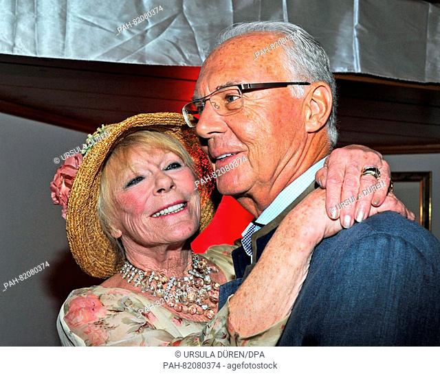 Actress Elke Sommer and football legend Franz Beckenbauer pose at the get-together of the Bavarian evening in the context of the 29th Kaiser Cup golf tournament...