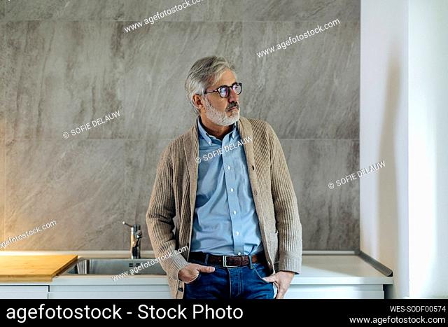 Mature man in kitchen at home