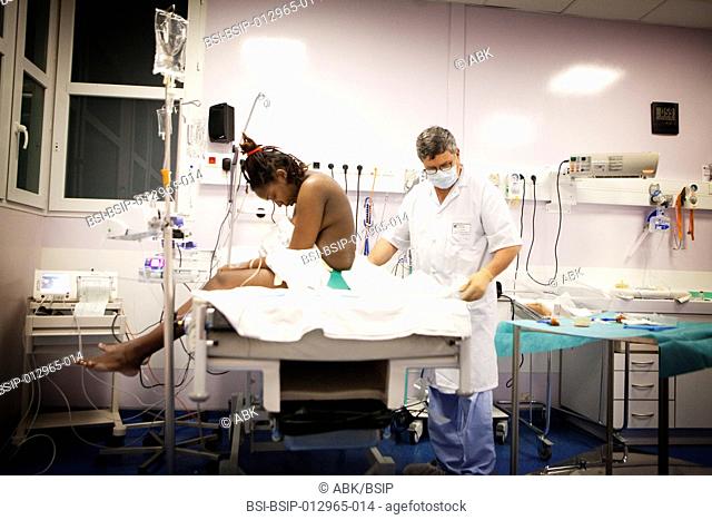 Photo essay at the maternity of Saint Maurice hospital in France. Woman pregnant with twins in the labor ward. Epidural anesthaesia