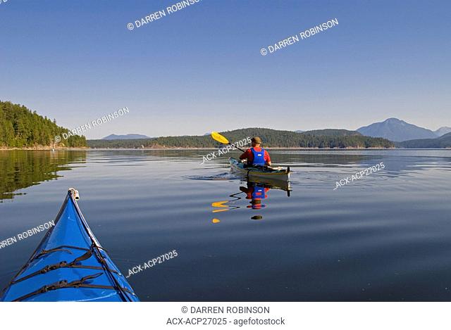Kayaking the beautiful waters in pristine Desolation Sound near Powell River, British Columbia, Canada