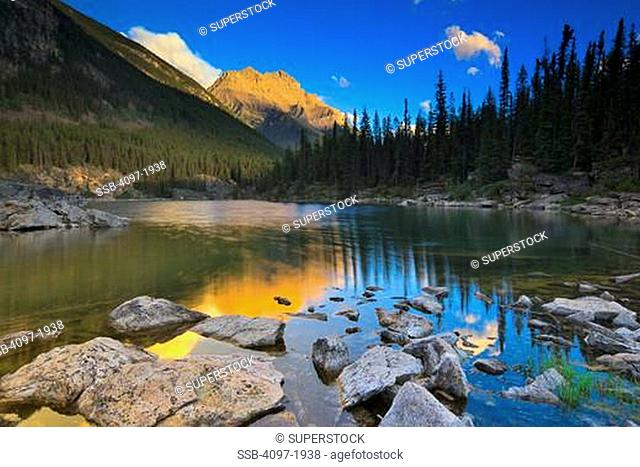 Lake with a mountain in the background, Horseshoe Lake, Mt Kerkeslin, Jasper National Park, Alberta, Canada