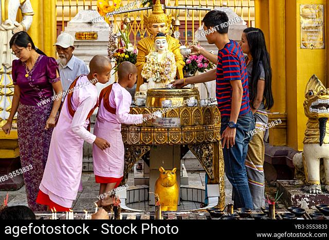 Burmese People Bathing The Buddha At The Shwedagon Pagoda, Yangon, Myanmar