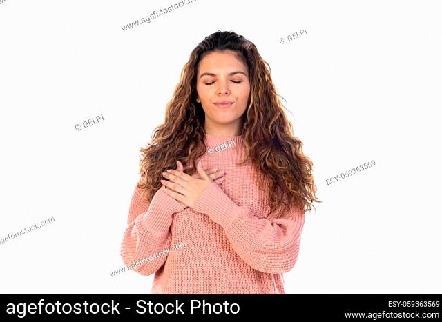 Beautiful middle aged woman with pink woolen sweater isolated on a white background