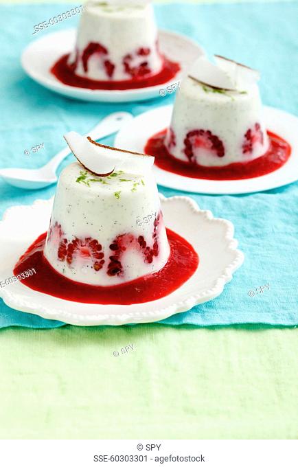Coconut-vanilla panna cotta with raspberries and lime