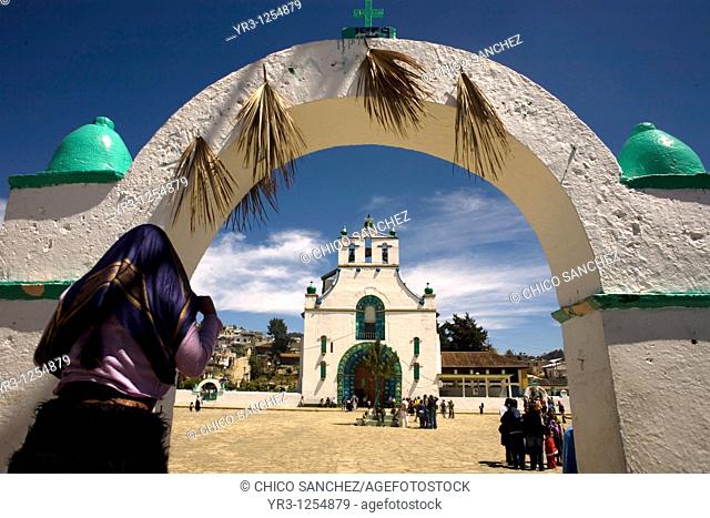 A woman wearing a headscarf enters the main plaza outside the church of San Juan Chamula, Chiapas, Mexico