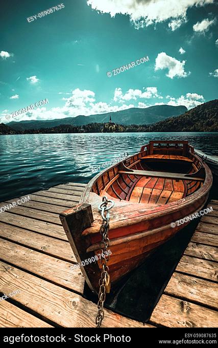 Amazing landscape of Lake Bled in Slovenia - traditional Pletna boat. Lake bled is a famous place and popular European travel destination