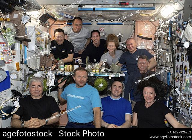 The ten inhabitants of the International Space Station (ISS) are gathered together in the Unity module for a meal and a portrait on October 8, 2021