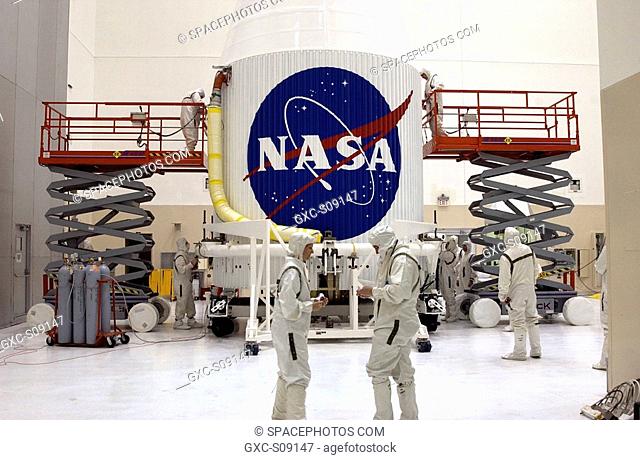 02/23/2002 -- Workers in the Spacecraft Assembly and Encapsulation Facility-2 SAEF-2 make final adjustments on the nose fairing surrounding the Tracking and...