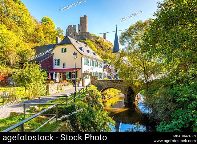 View of Elz Bridge in Monreal in the Eifel, most beautiful village in Rhineland-Palatinate, located in the Elz valley, well-preserved half-timbered houses