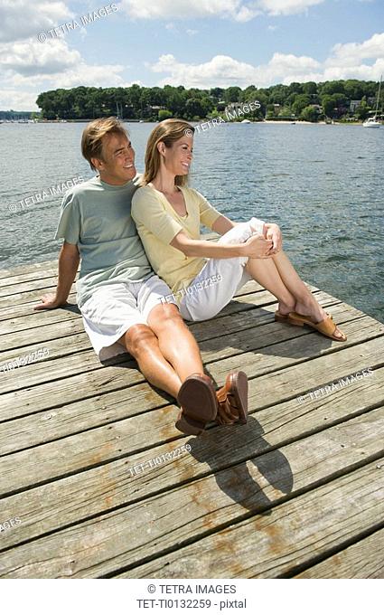 Couple sitting on dock