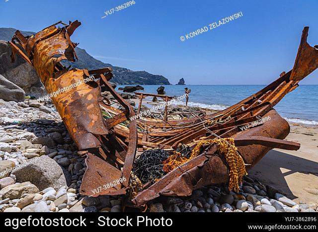 Remains of fishing boat on a shore in Agios Gordios town on a Greek Island of Corfu