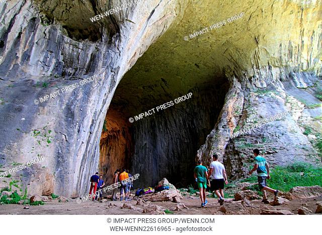 Bungee jumpers hurl themselves over the Prohodna cave entrance and tourists observe the ""The Eyes of God"" stone phenomenon near the village of Karlukovo