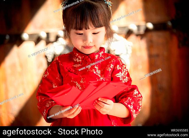 Cute girl with a red envelope