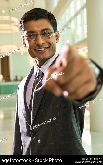 Indian businessman pointing