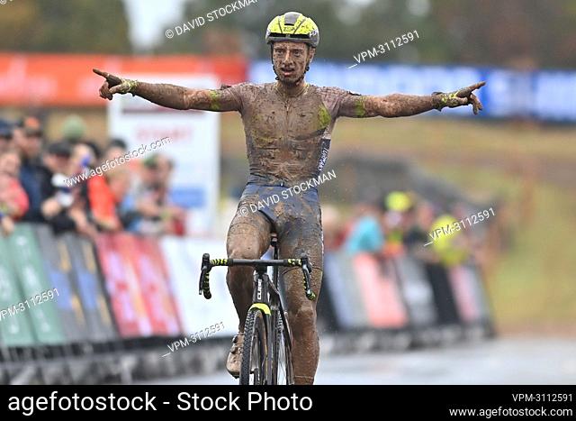 Belgian Quinten Hermans celebrates as he crosses the finish line to win the men elite race of the World Cup cyclocross in Fayetteville, Arkansas, USA