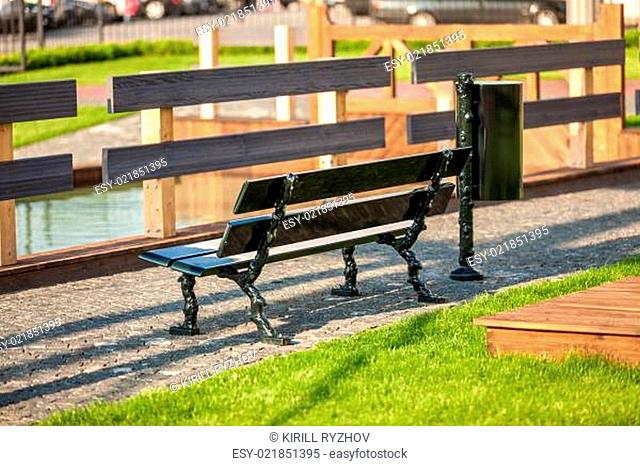 photo of bench at park near river