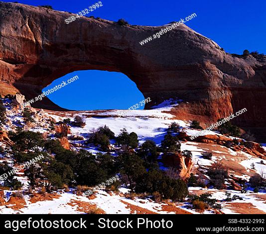 Winter view of Wilson Arch with an opening 91 feet wide and 46 feet high, along US 191 twenty-four miles south of Moab, Utah