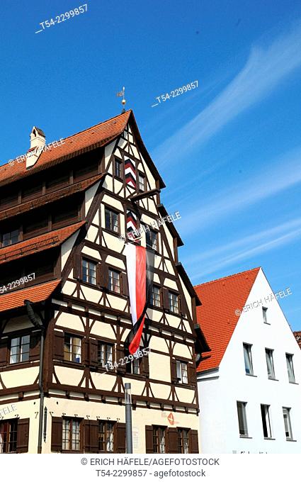 The Siebendächerhaus in Memmingen with city flag hoisted, Bavaria, Germany