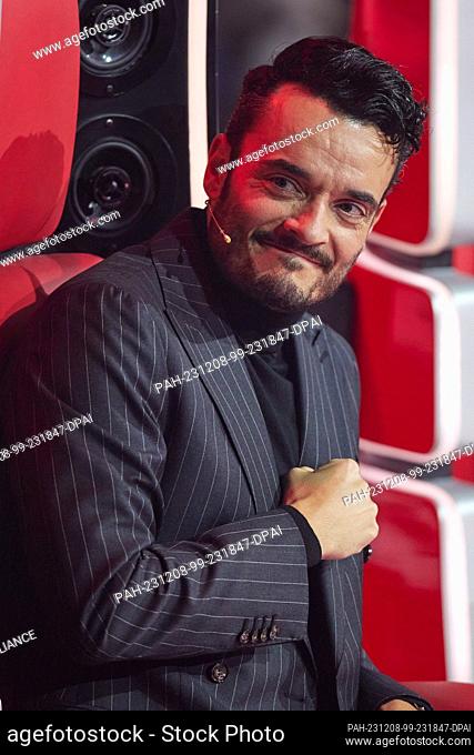 08 December 2023, Berlin: Coach Giovanni Zarrella is on stage in the final of the Sat.1 show ""Voice of Germany"". Five candidates are singing for victory today