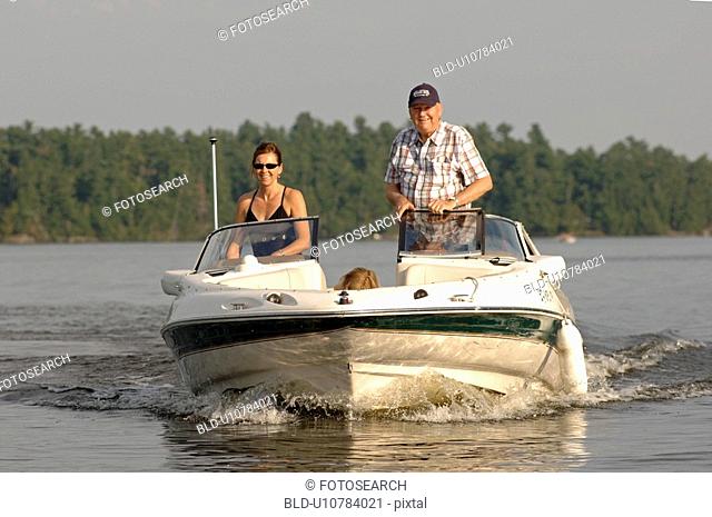 Woman and man standing in a boat