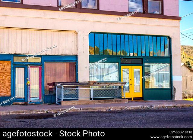 Abandoned Two Story Commercial Store Front Building With Blocked Out Windows