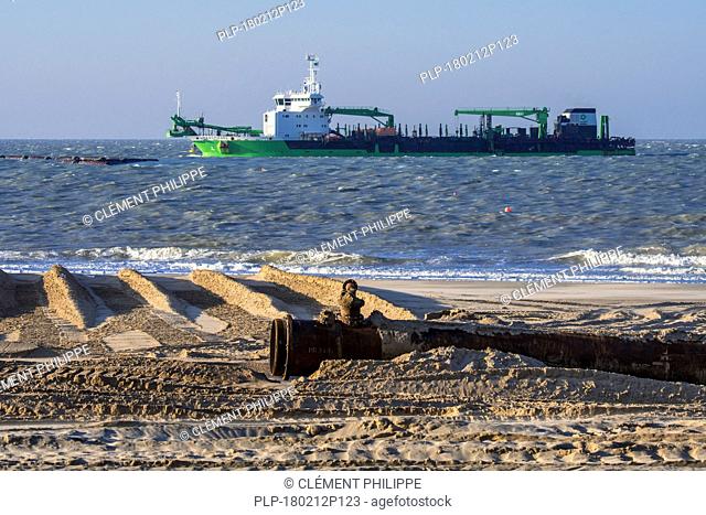 DEME trailing suction hopper dredger Uilenspiegel at sea, used for sand replenishment / beach nourishment to make wider beaches to reduce storm damage