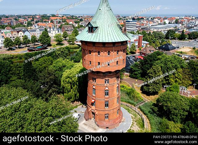 PRODUCTION - 22 June 2023, Lower Saxony, Cuxhaven: The historic water tower is located in the city center (aerial view by drone)